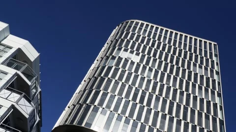 Bottom-Up View of a Skyscraper Against Clear Blue Sky Stock-Footage 322165300