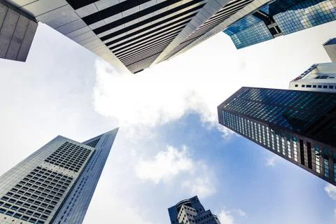 Bottom view of Skyscraper and blue sky background Stock Photos