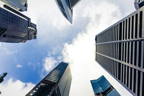 Bottom view of Skyscraper and blue sky background Stock Photos