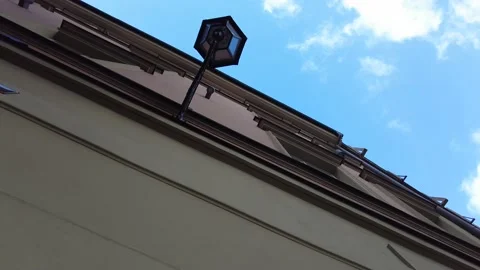 Bottom view of a street lantern, historical building and sky Stock Footage 232315083