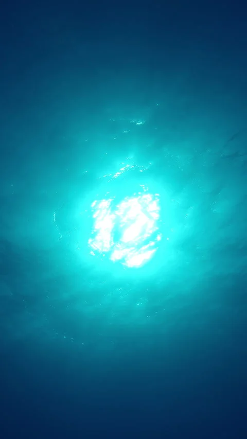 Bottom view on sun from blue abyss, Slow motion of light filters down through Stock Footage 331803491