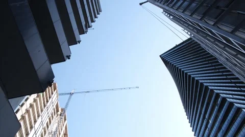 Bottom view. Two beautiful modern office skyscrapers against the sky. Stock Footage 242610943
