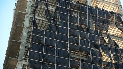 Bottom up view of an unfinished building consruction in downtown of the city Stock Footage 200453835