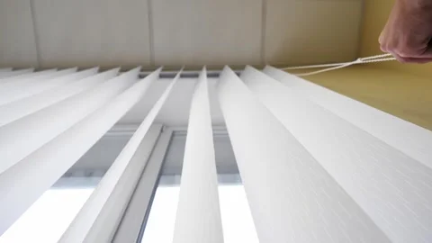 Bottom-up view of vertical blinds that open.  Stock Footage 260899469