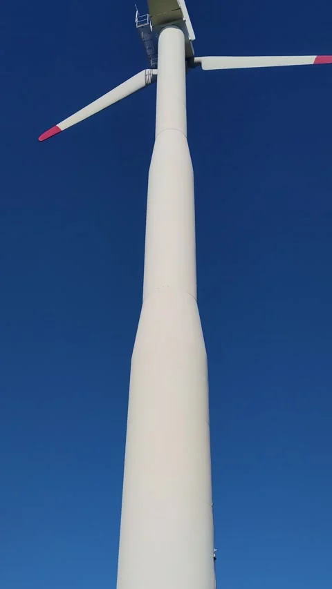 Bottom View of a Wind Turbine Against a Blue Sky.  Stock Footage 229411952