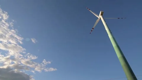 Bottom up view of wind turbine closeup on sky with clouds Stock Footage 201115884