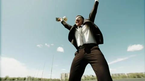 Bottom view of the winning businessman in an office suit with a cup in his hands Stock Footage 199780903