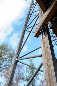 Bottom view of wooden supports with metal diagonal links of the structure. Stock Photos