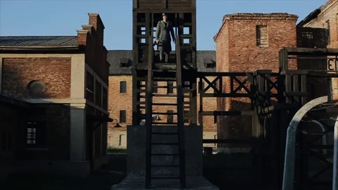 Bottom view of a young German soldier with a rifle going down the stairs of a Stock-Footage 113944680