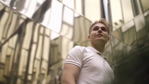 Bottom view of a young positive handsome confident joyful blond man Stock Footage 114453531