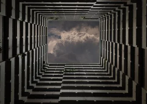 Bottoms up view of the cascading rectangular corridors balcony opening up of Stock Photos