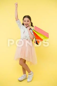 Bought new dress. Girl shopaholic likes shopping on sale season. Child cute Stock Photos
