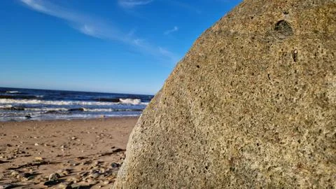 Boulder Close-up with Ocean Waves Background Stock Photos