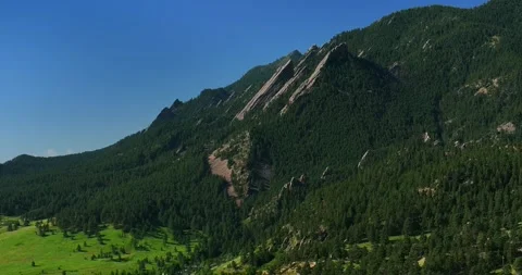 Boulder Colorado Flatirons slanted Front Range Rocky Mountains aerial drone Stock Footage 316573639