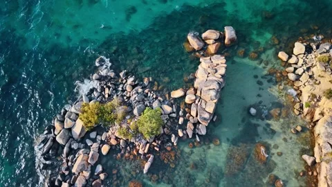 Boulder formation surrounded by shallow Lake Tahoe water. An overhead view shows Stock Footage 346724855