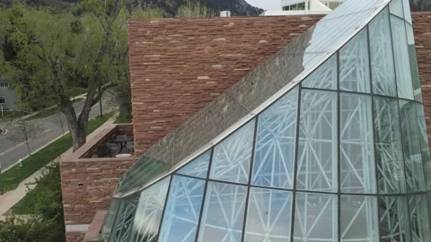 Boulder Library - Drone moves up to top then out to the city and mountain Stock Footage 138877524