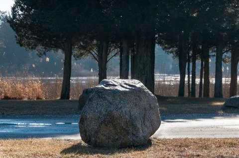 Boulder marking road Stock Photos