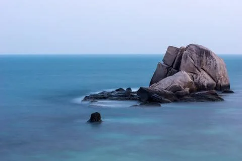 Boulder in the ocean Stock Photos