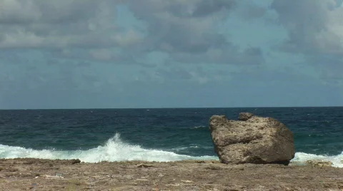Boulder &amp; a rough shore - medium Stock Footage 91115