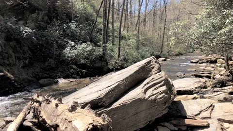Boulder in the stream near Looking Glass Waterfalls North Carolina 4K Stock Footage 89606450