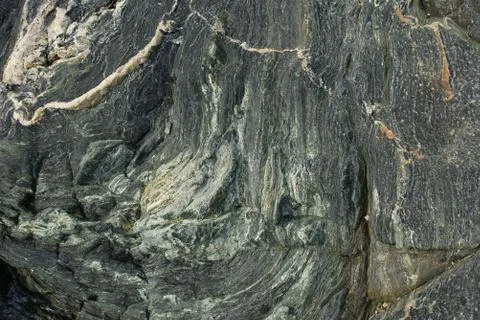 Boulder surface texture in shades of grey and white - top view. Stock Photos