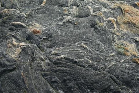 Boulder surface texture in shades of grey and white - top view. Stock Photos