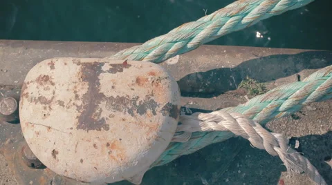 Boulder with thick rope attached at harbour, graded Stock Footage 57362888