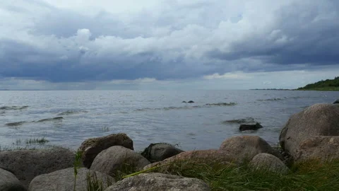 Boulders by the lake dramatic landscape Stock Footage 138402203