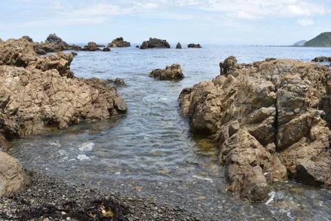 Boulders in the ocean Stockfoto's