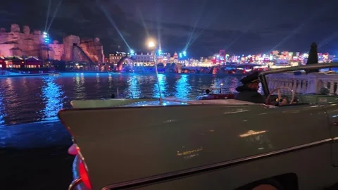 Boulevard World in Riyadh night view with buildings, vintage car, and boats Vídeos de archivo 306288873