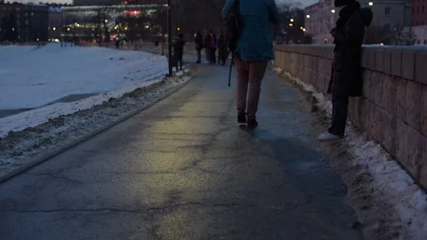 Boulevards by river with people walking in the evening. Walking path in city. Stock Footage 147941040