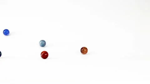 Bouncing and rolling marbles in a playful and dynamic motion, creating an e.. Stock Footage 333352252