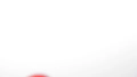 Bouncing balls falling onto a white background, red and white ping-pong Stock Footage 90769555