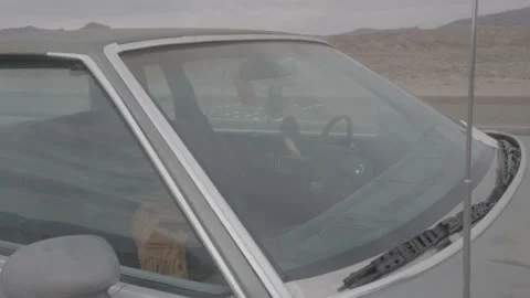 Bouncing car in death valley desert nirvana Stock Footage 188731402