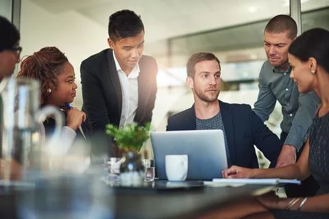 Bouncing some ideas around. Shot of a group of businesspeople meeting in the Stock Photos