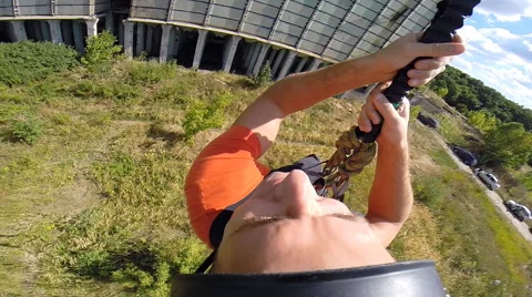 Bouncing swinging on a rope after the jump shot in the first person Stock Footage