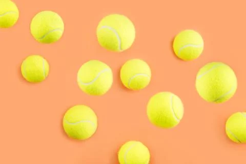Bouncing tennis ball pattern on orange Stock Photos