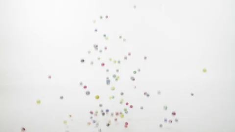 BOUNCY BALLS ON WHITE BACKGROUND Stock Footage 75730665