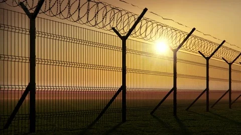 Boundary fence on sunset Stock Footage 74101537
