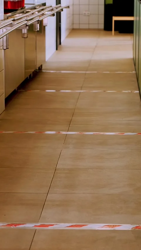 Boundary lines to maintain social distance between visitors in self-service Stock Footage 323365965
