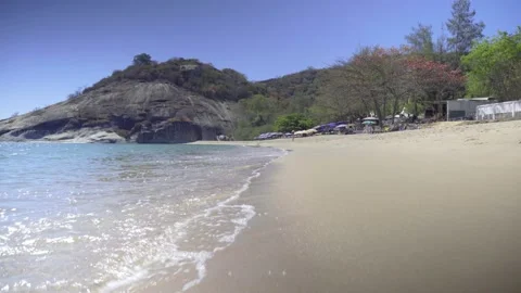 Boundless clean sand beach washing by tropical ocean Stock Footage 132486210