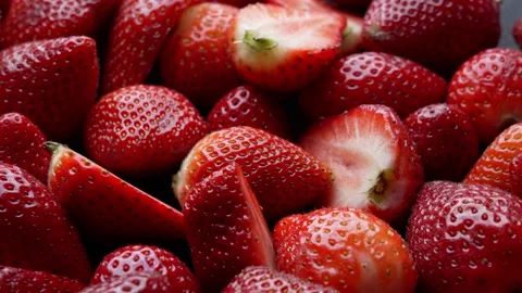 Bountiful Berries. Close Up of Fresh Ripe Strawberries in Rotation Stock Footage 241334535