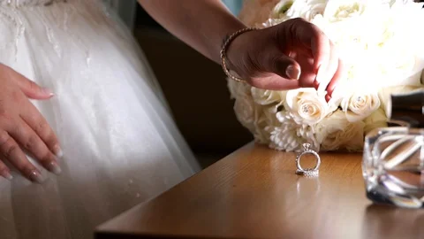 Bouquet of the bride with the wedding ring and shoe Stock Footage 129709306