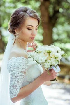 Bouquet in bride's hands Stock Photos