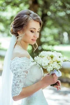 Bouquet in bride's hands Stock Photos