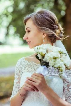 Bouquet in bride's hands Stock Photos