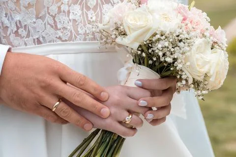 Bouquet in bride's hands. Stock Photos