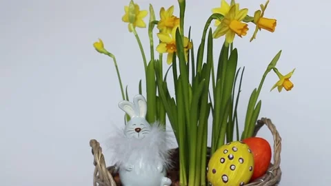 Bouquet of daffodils, Easter eggs and a rabbit. Minimal concept. copy space Stock Footage 170583716
