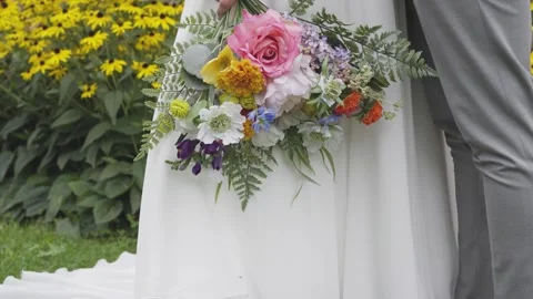 Bouquet Dangling in Bride's Hand Stock Footage 262869453