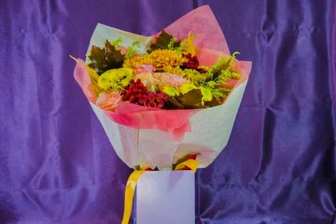 A bouquet of flowers is in the box. Stock Photos